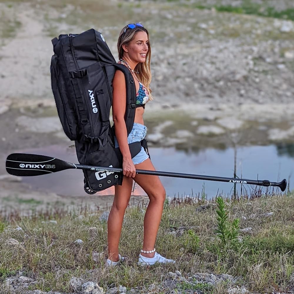 NIXY Inflatable Paddle Board Carrying Backpack - Compact Hands-Free Travel Backpack for iSUP, Durable, Padded Shoulder Straps NIXY Inflatable Paddle Board Carrying Backpack - Compact Hands-Free Travel Backpack for iSUP, Durable, Padded Shoulder Straps